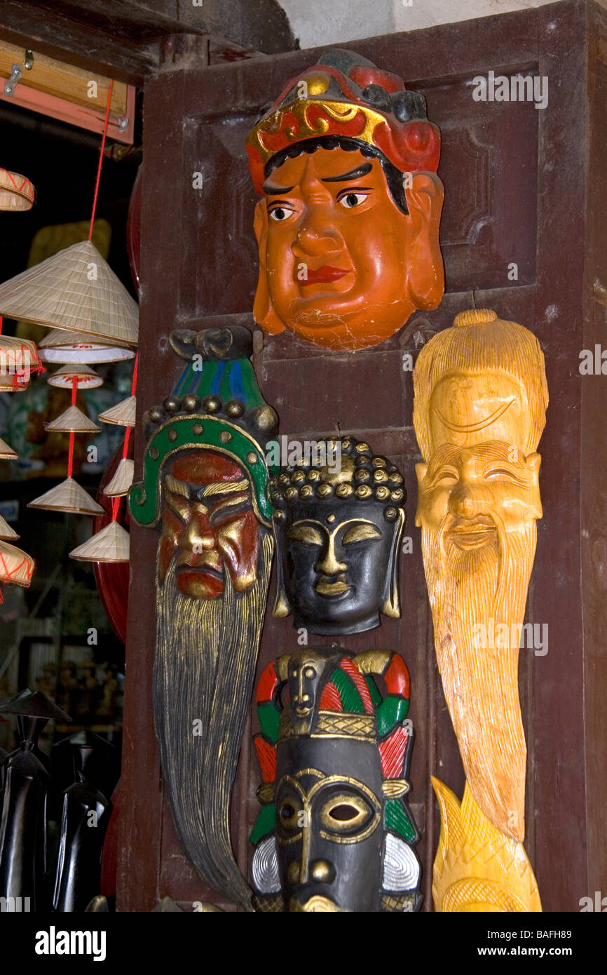 Painted ceremonial masks being sold for Tet in Hanoi Vietnam Stock Photo