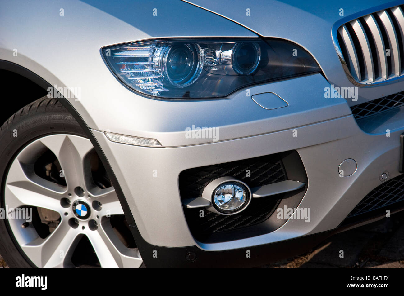 Silver BMW X6 front close up with headlight Stock Photo Alamy