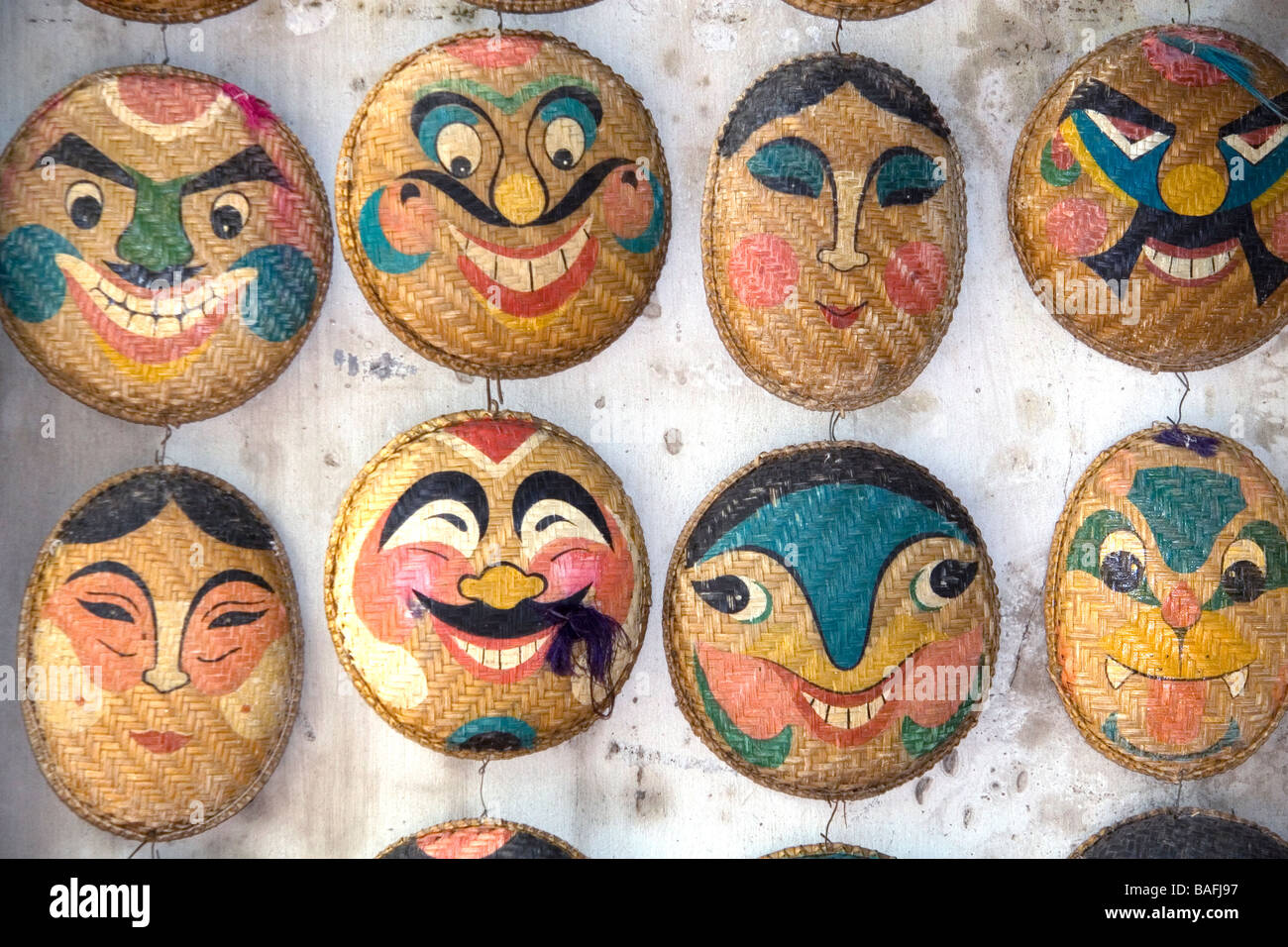 Painted ceremonial masks being sold for Tet in Hanoi Vietnam Stock Photo