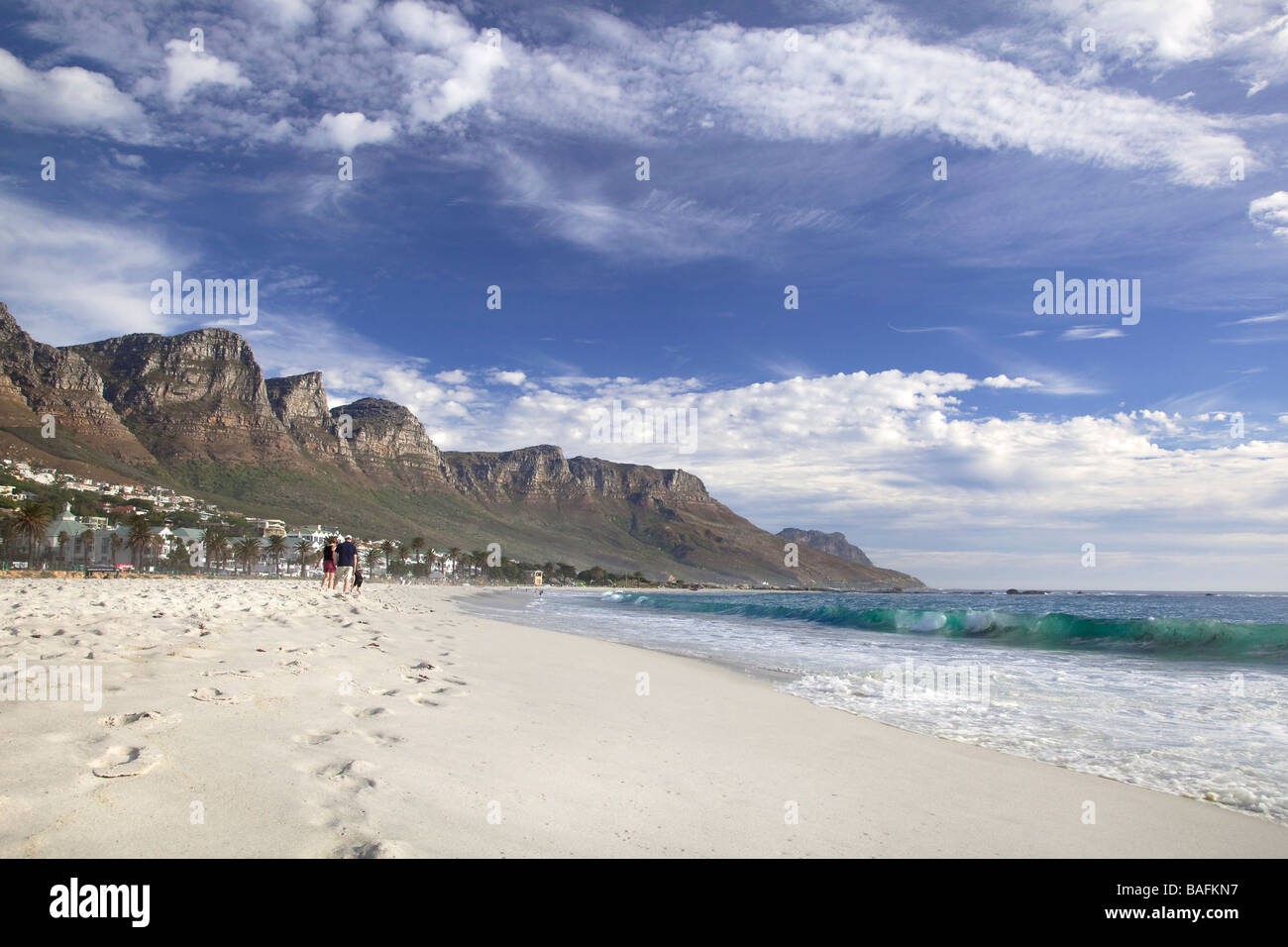 View along Camps Bay beach to Twelve Apostles mountains range, Cape Town, South Africa Stock Photo