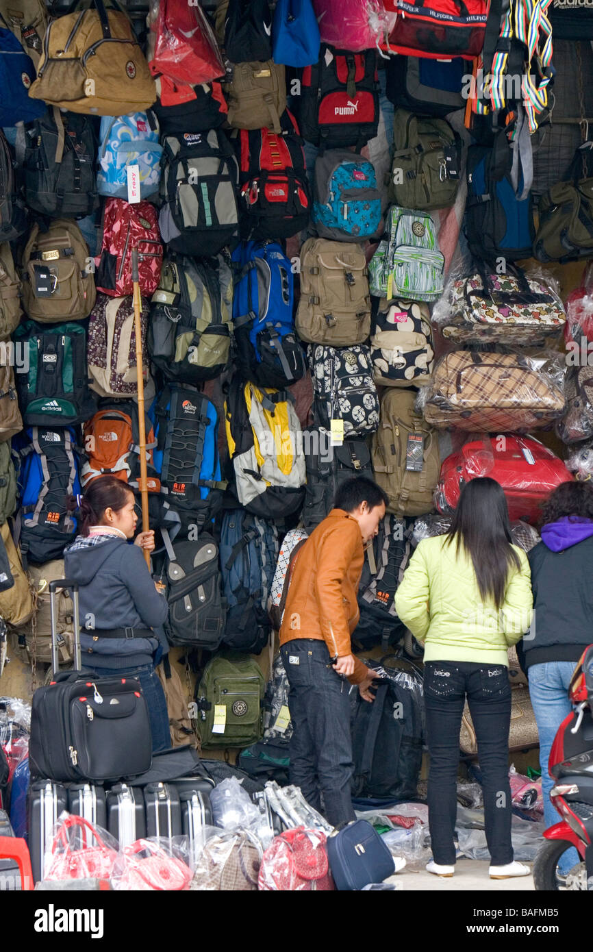 Vendor selling bags in a street market, New Delhi, India Stock