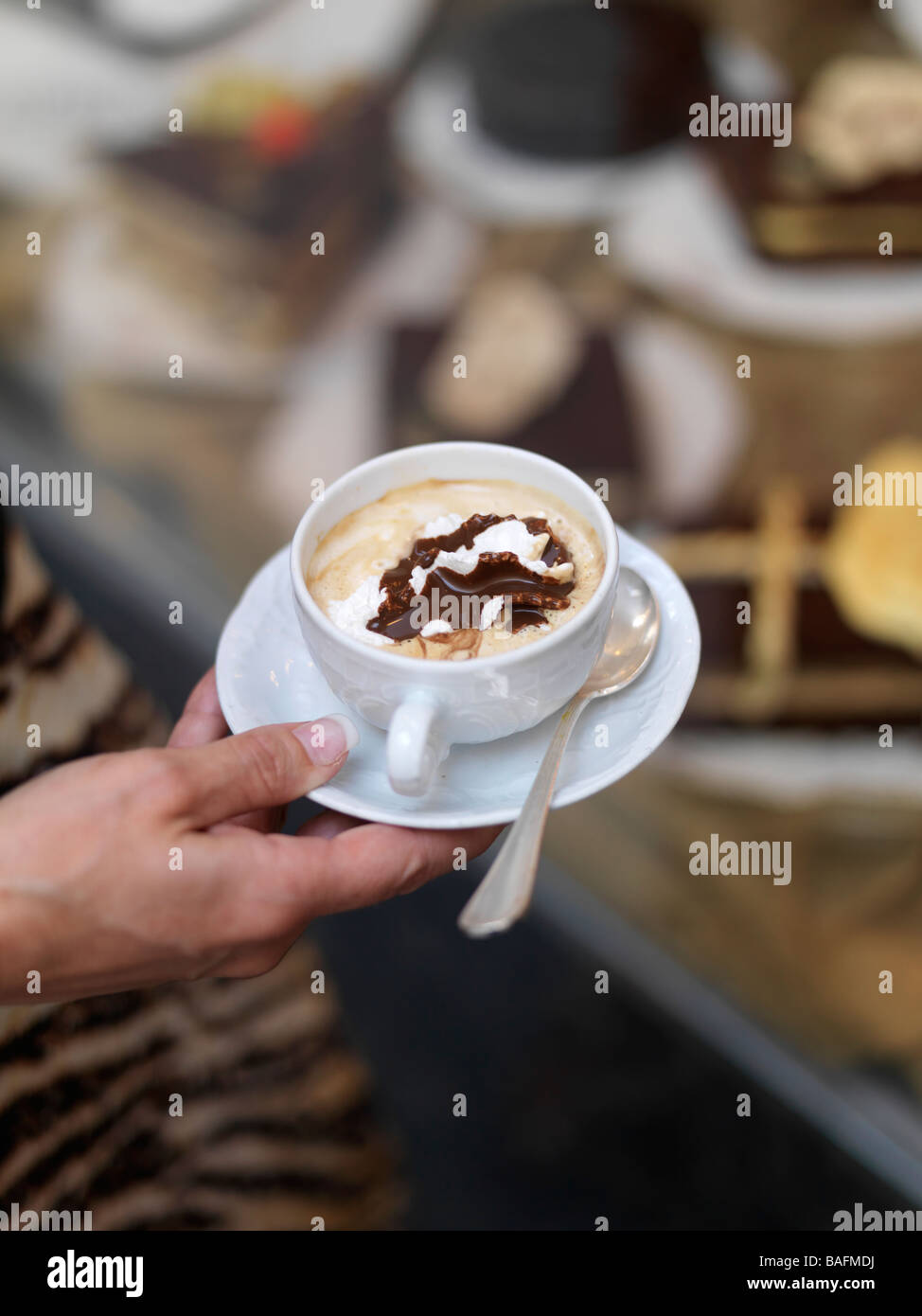 A hot macchiato is served strong with a dollop of cream and chocolate in Perugia, Italy. Stock Photo