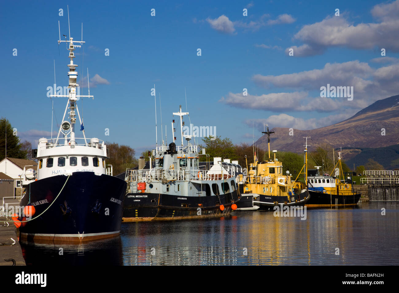 Boats moored on the Caledonian Canal at the Corpach Sea Loch Stock Photo