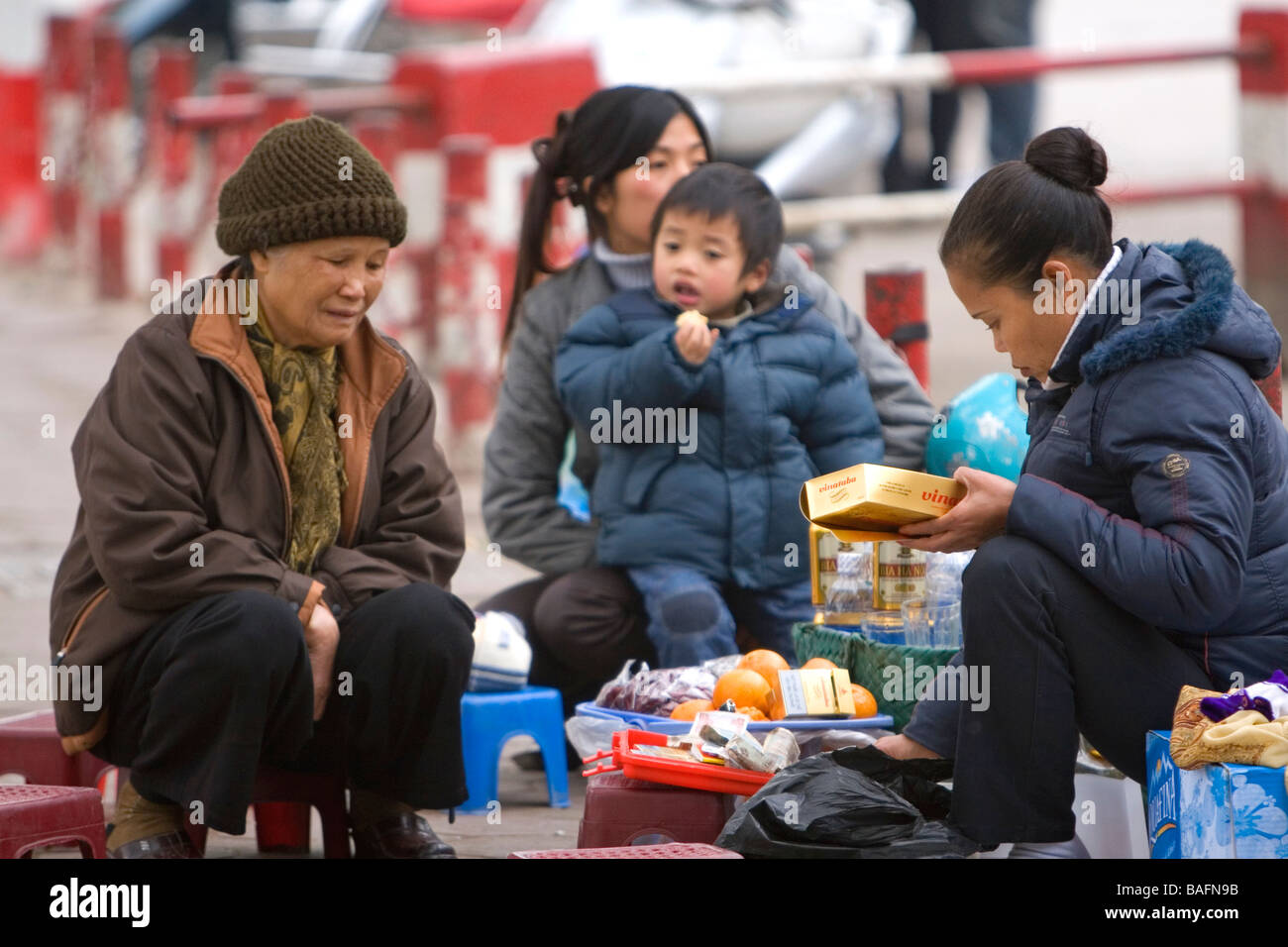 Vietnamese family having a picnic during Tet festivities in Hanoi Vietnam Stock Photo