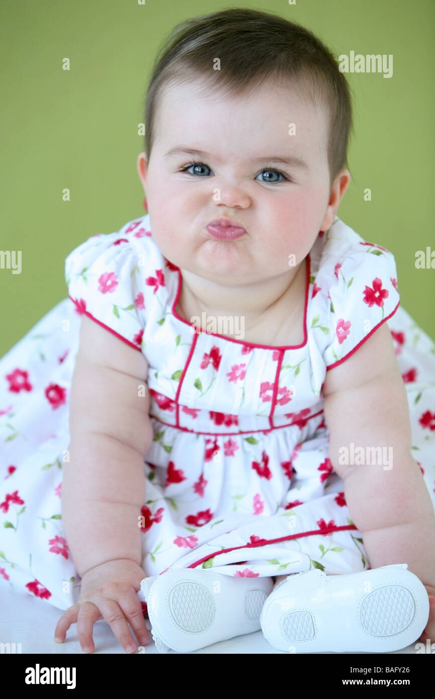 Baby girl with funny face Stock Photo