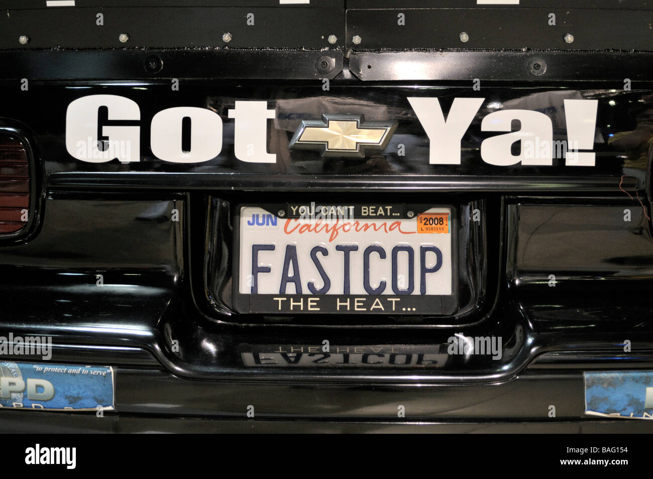 Portion of tail end of unusual police car sporting a vanity California license plate spelling 'FASTCOP' Stock Photo