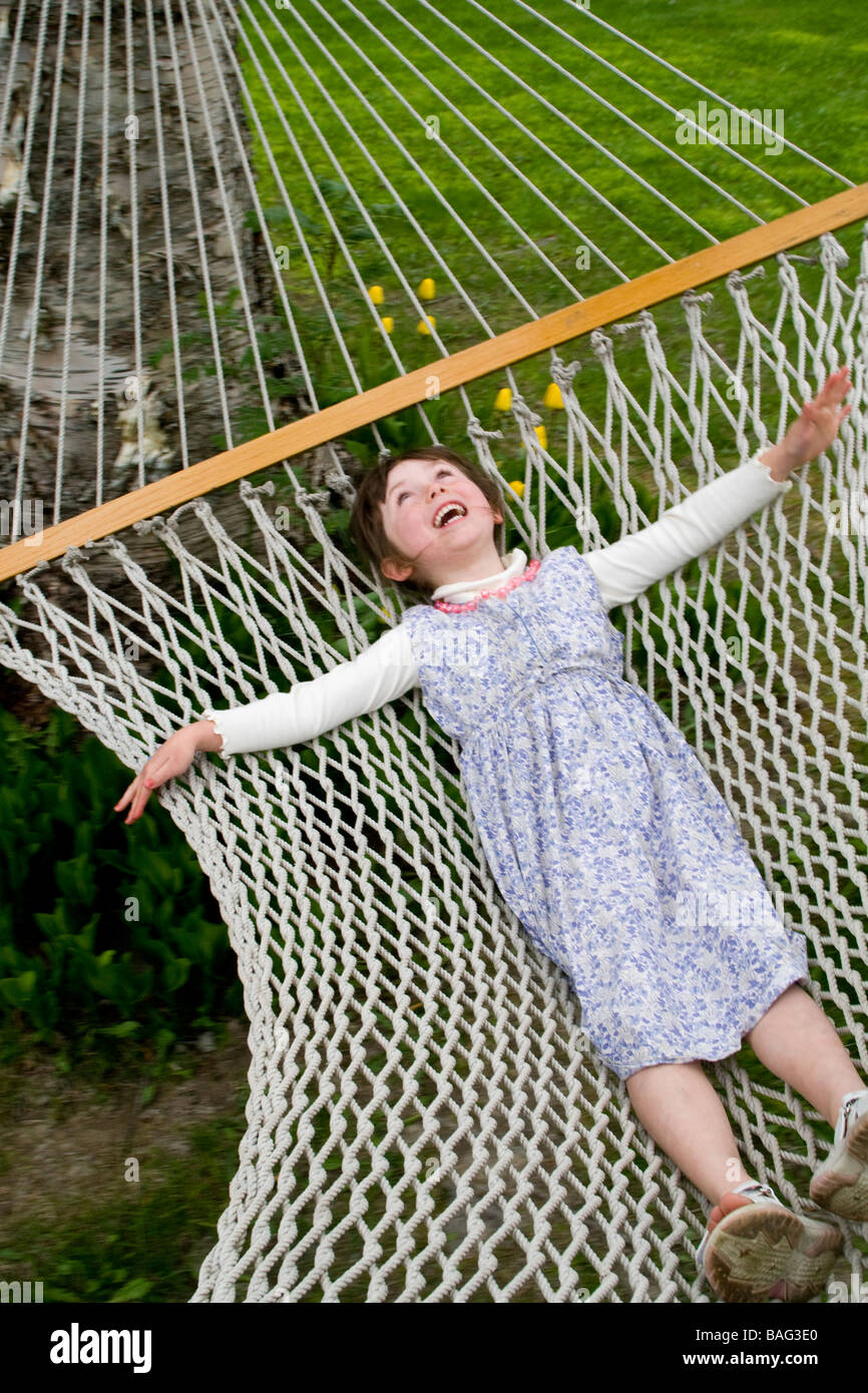 Young girl laying on a hamock Pemperton British Columbia Canada Stock Photo