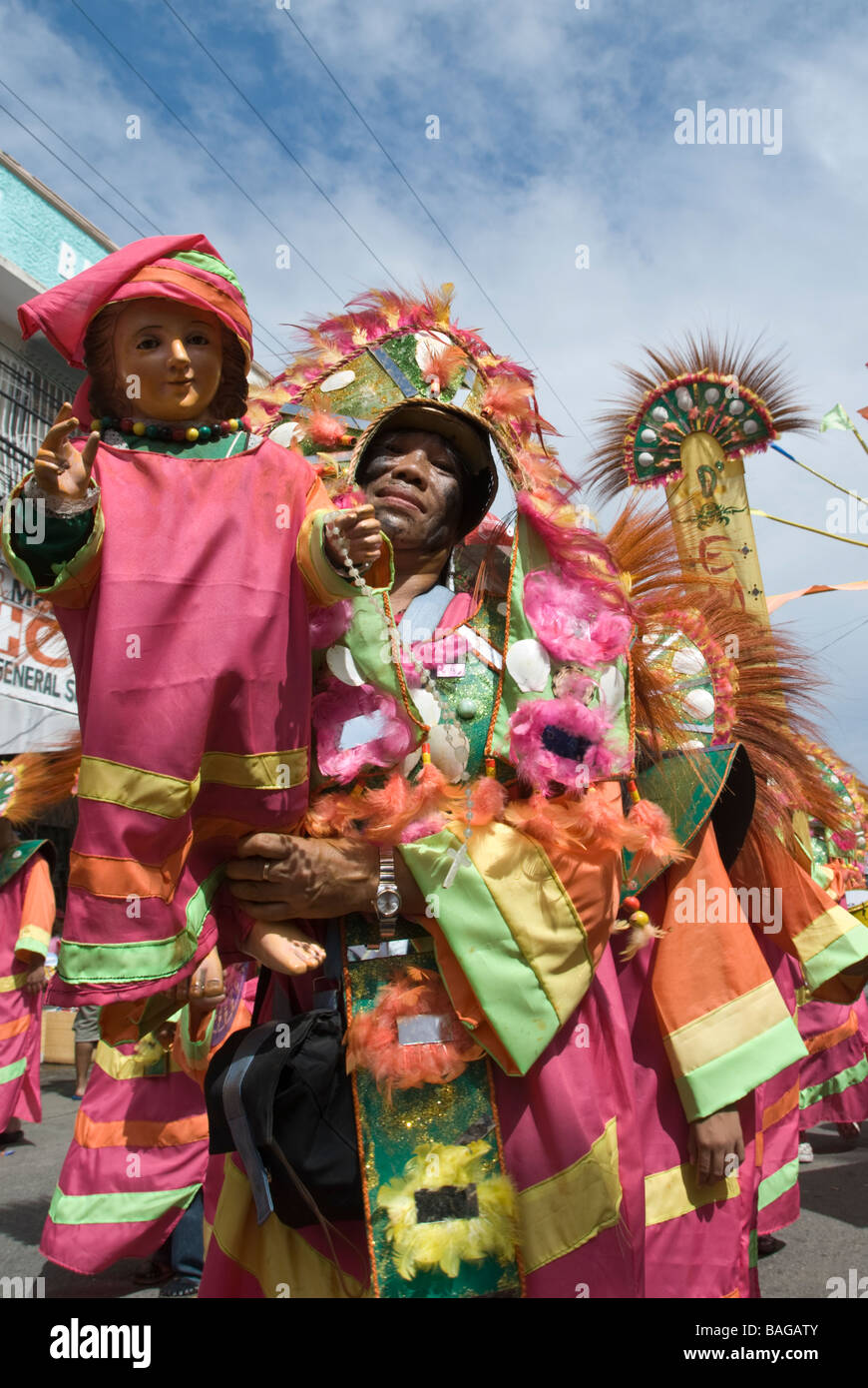 Man with Santo Niño figure at the Ati-Atihan festival in Kalibo, Philippines Stock Photo