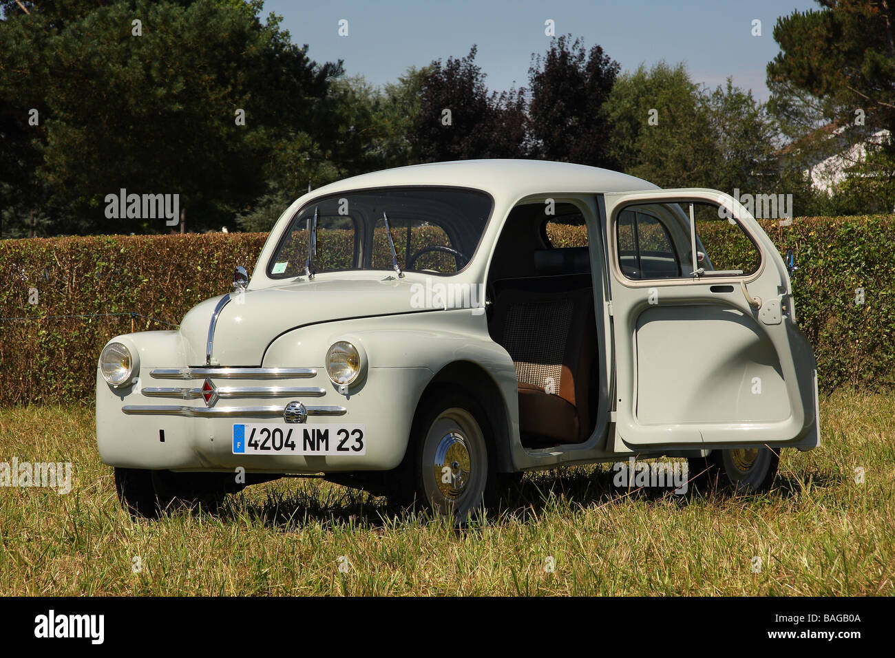 A well restored 1961 Renault 4cv modele affair in a field Drivers door open  747cc 3 speed Limousin France Stock Photo - Alamy