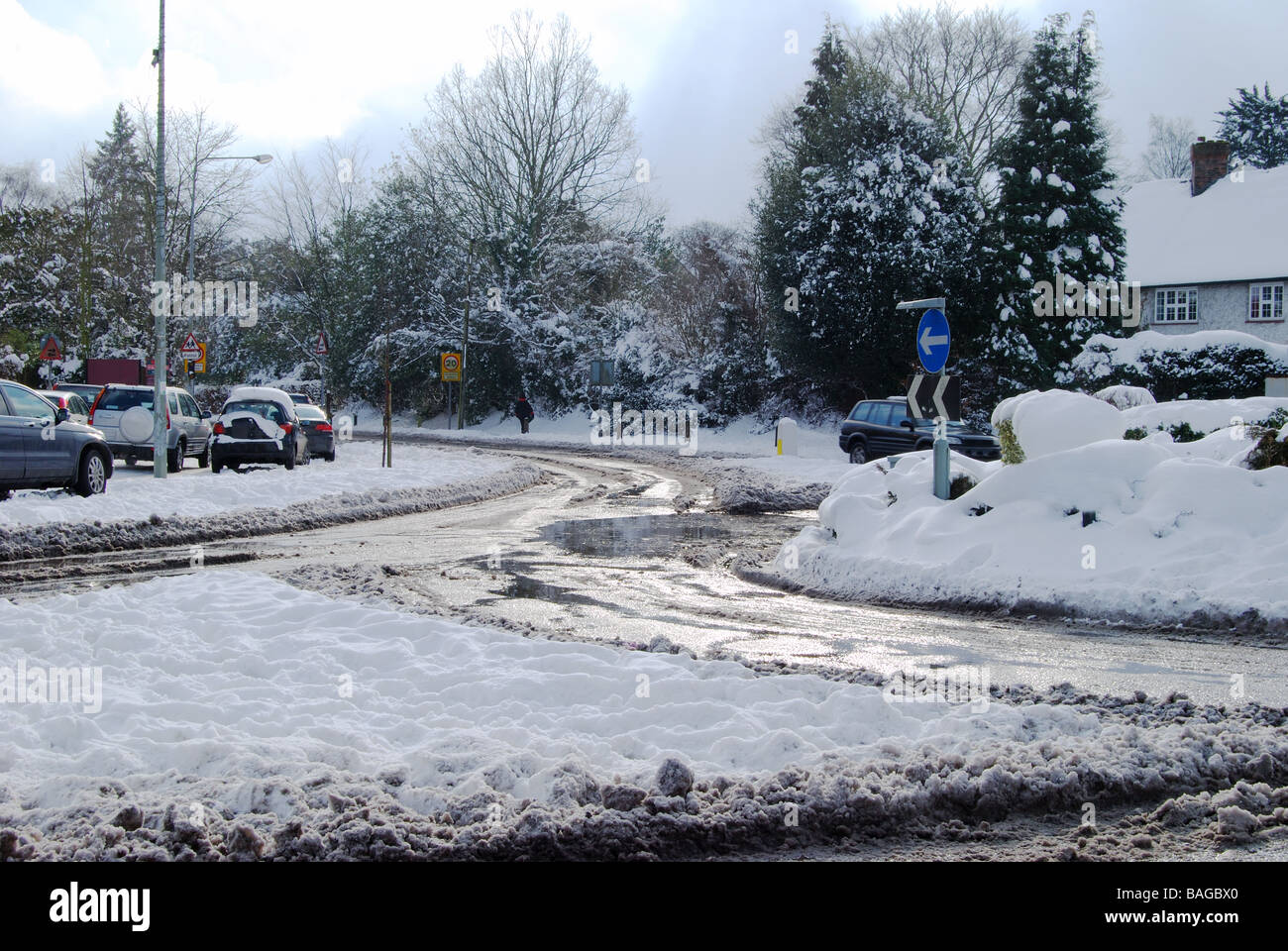 Road and traffic under snow in urban area Banstead Surrey England Stock