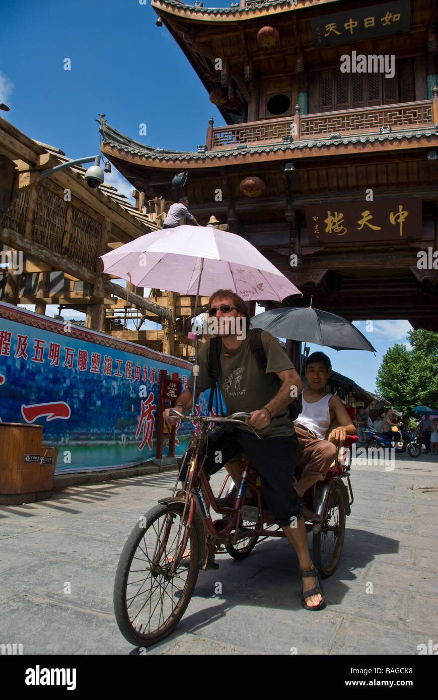 Tourist driving a rickshaw in Langzhong, Sichuan, China Stock Photo - Alamy