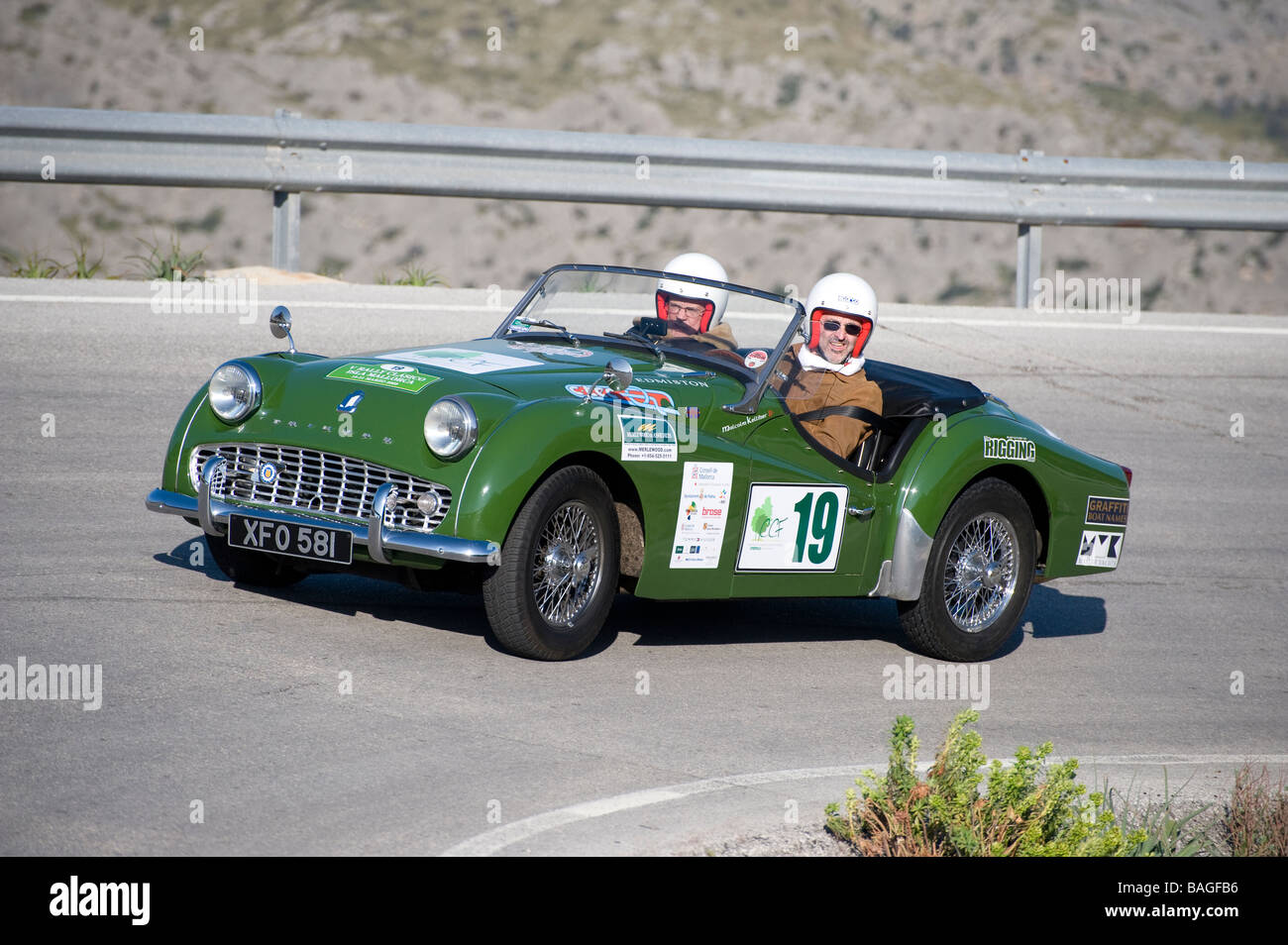 Green 1960 Triumph TR3a classic sports car racing in the Mallorca