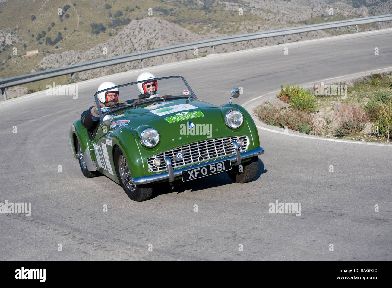 Green 1960 Triumph TR3a classic sports car racing in the Mallorca