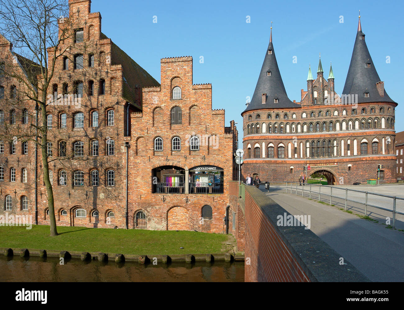 Salt store houses in Lubeck located adjacent to Holstentor viewed from bridge over Trave Stock Photo