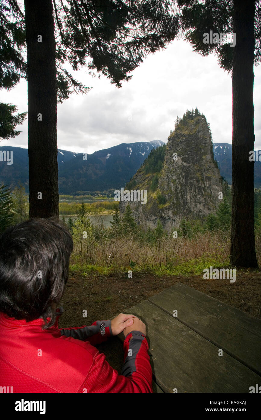 Man looking out on Beacon Rock Beacon Rock State Park, North Bonneville, Washington Stock