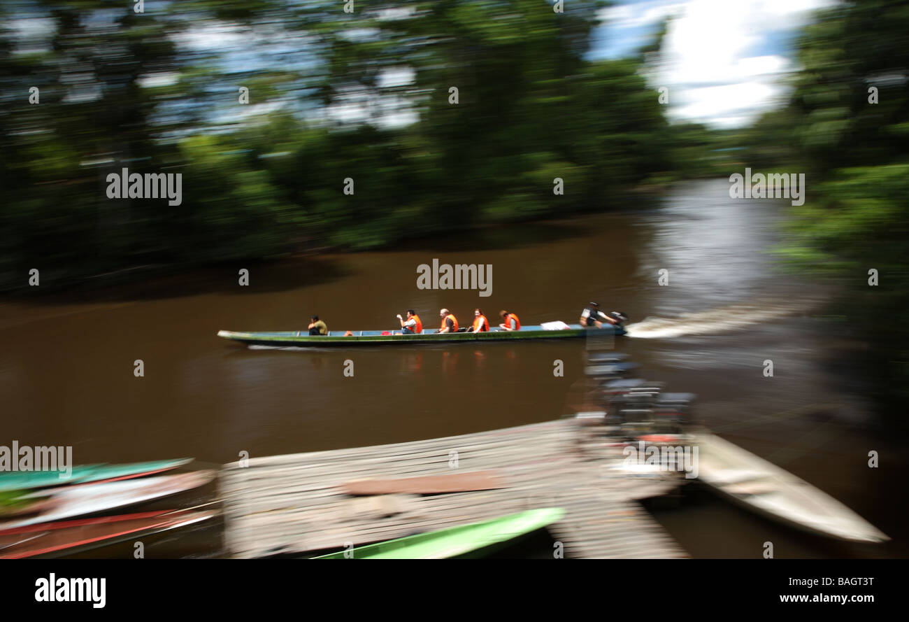 Aboard a dug-out canoe on the Melinau River in Mulu, Borneo Stock Photo