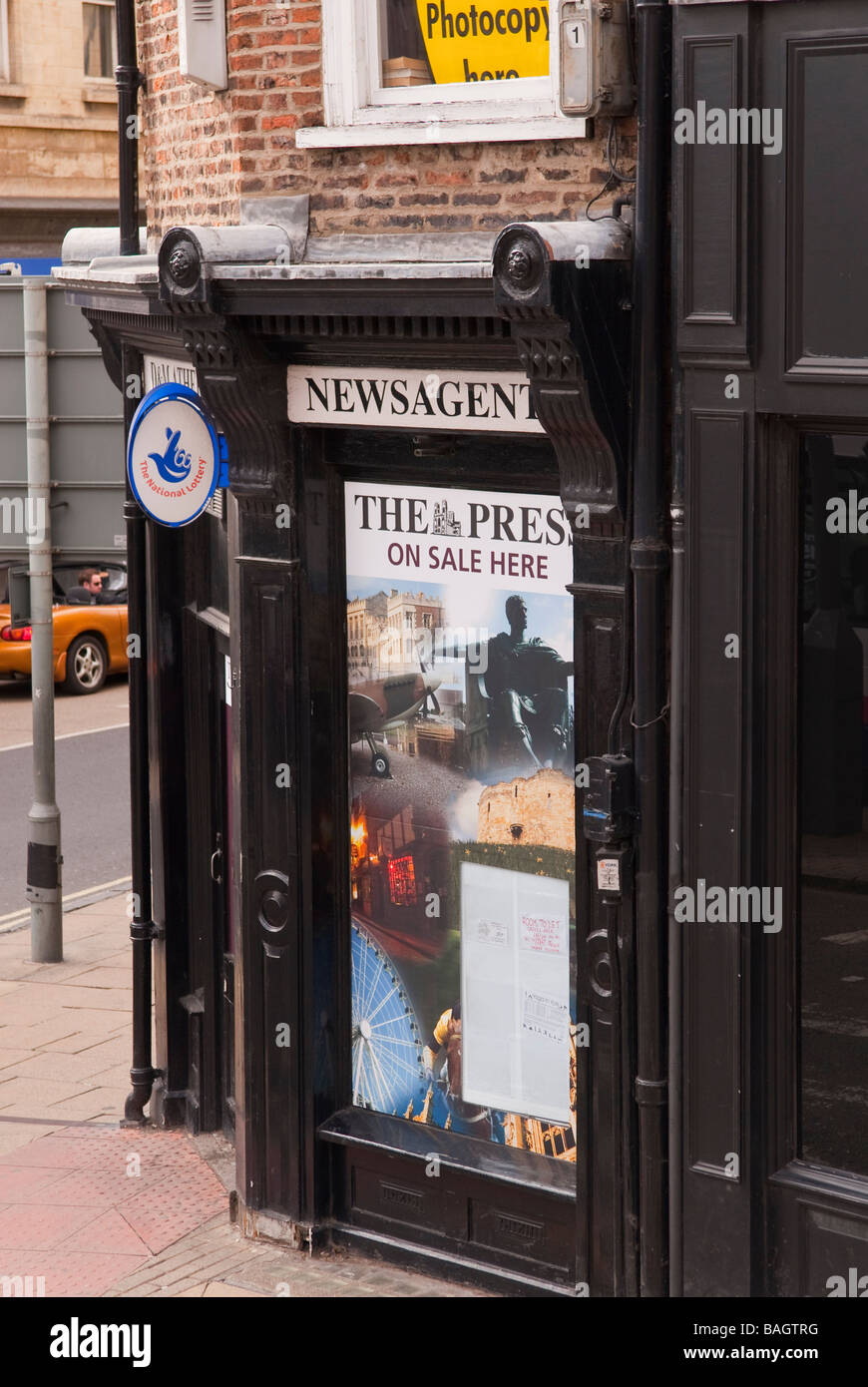 A newsagents shop store advertising newspapers for sale in the Uk Stock Photo