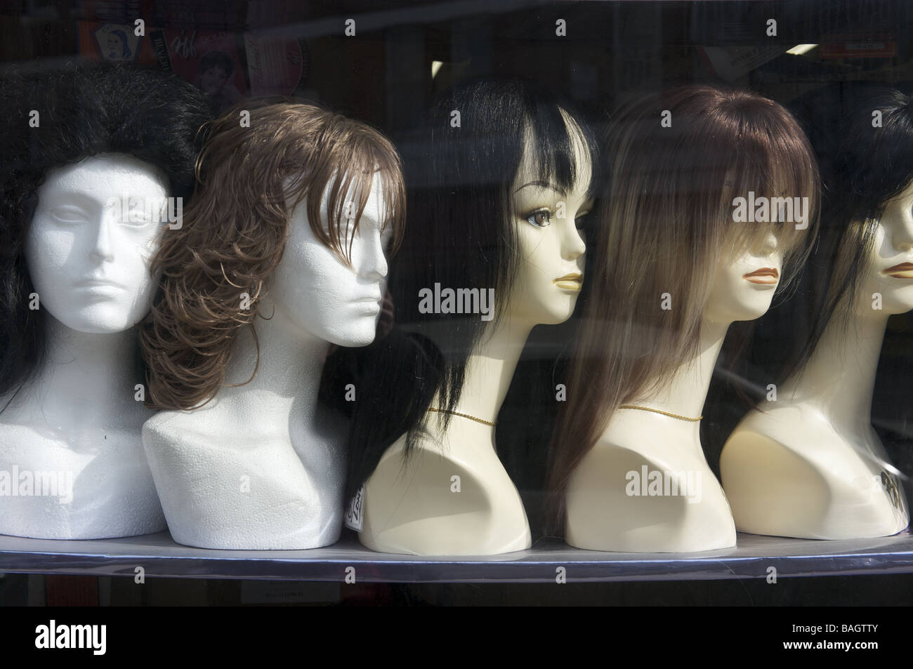 Wig shop window with mannequins Stock Photo Alamy