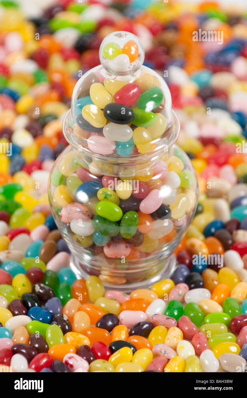 Jellybeans around a jar full of jellybeans Stock Photo Alamy