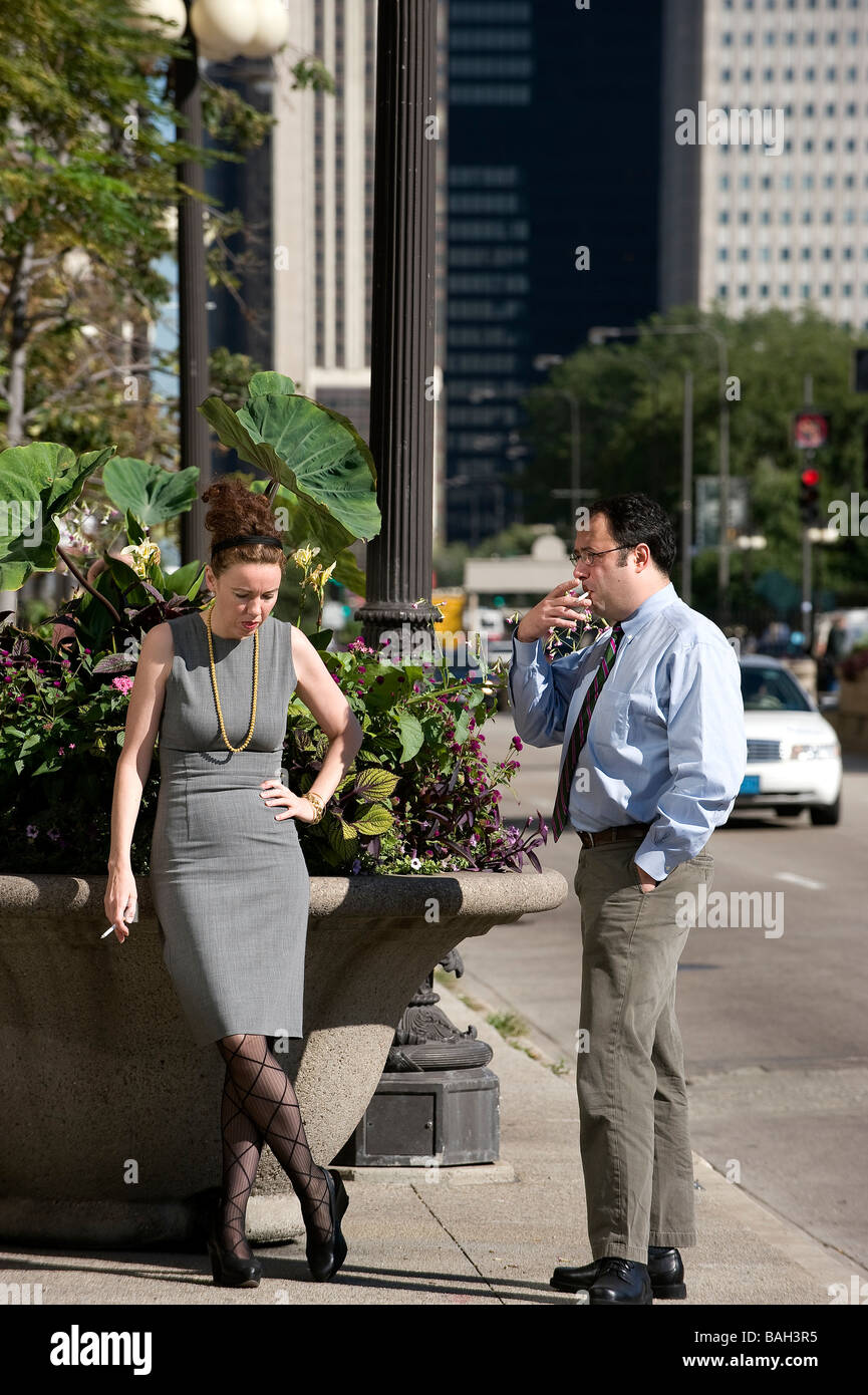 Woman smoking cigarette in street hi-res stock photography and images