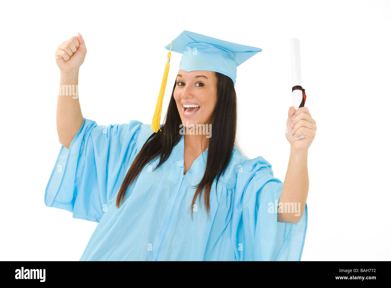 A female caucasian in light blue graduation gown and very excited She