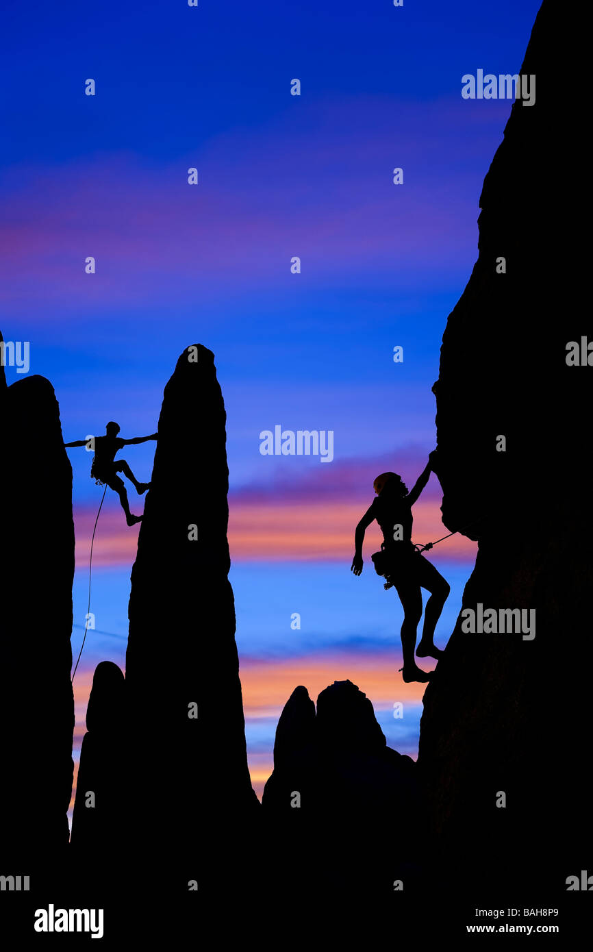Team of rock climbers nearing the summit Stock Photo Alamy