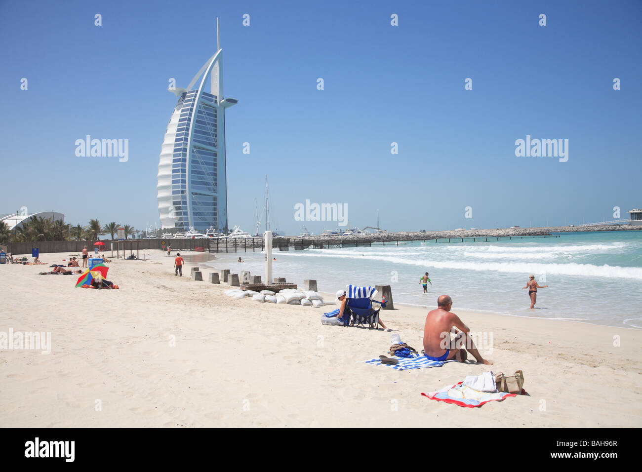 View of Burj Al Arab Hotel from public beach in Jumeirah Dubai United Arab Emirates Stock Photo