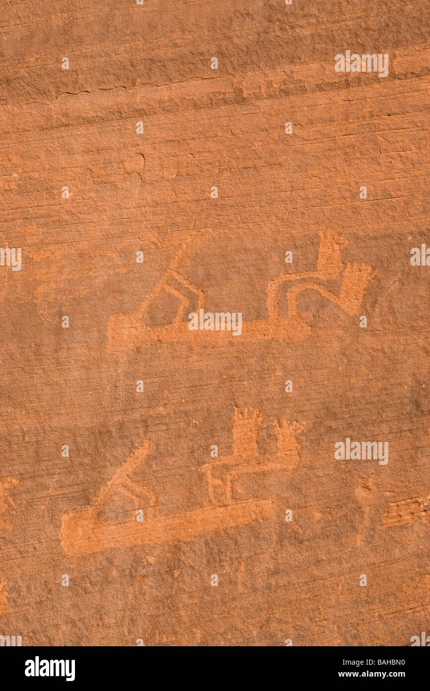 Navajo hieroglyphics carved in sandstone showing kokopelli Stock Photo