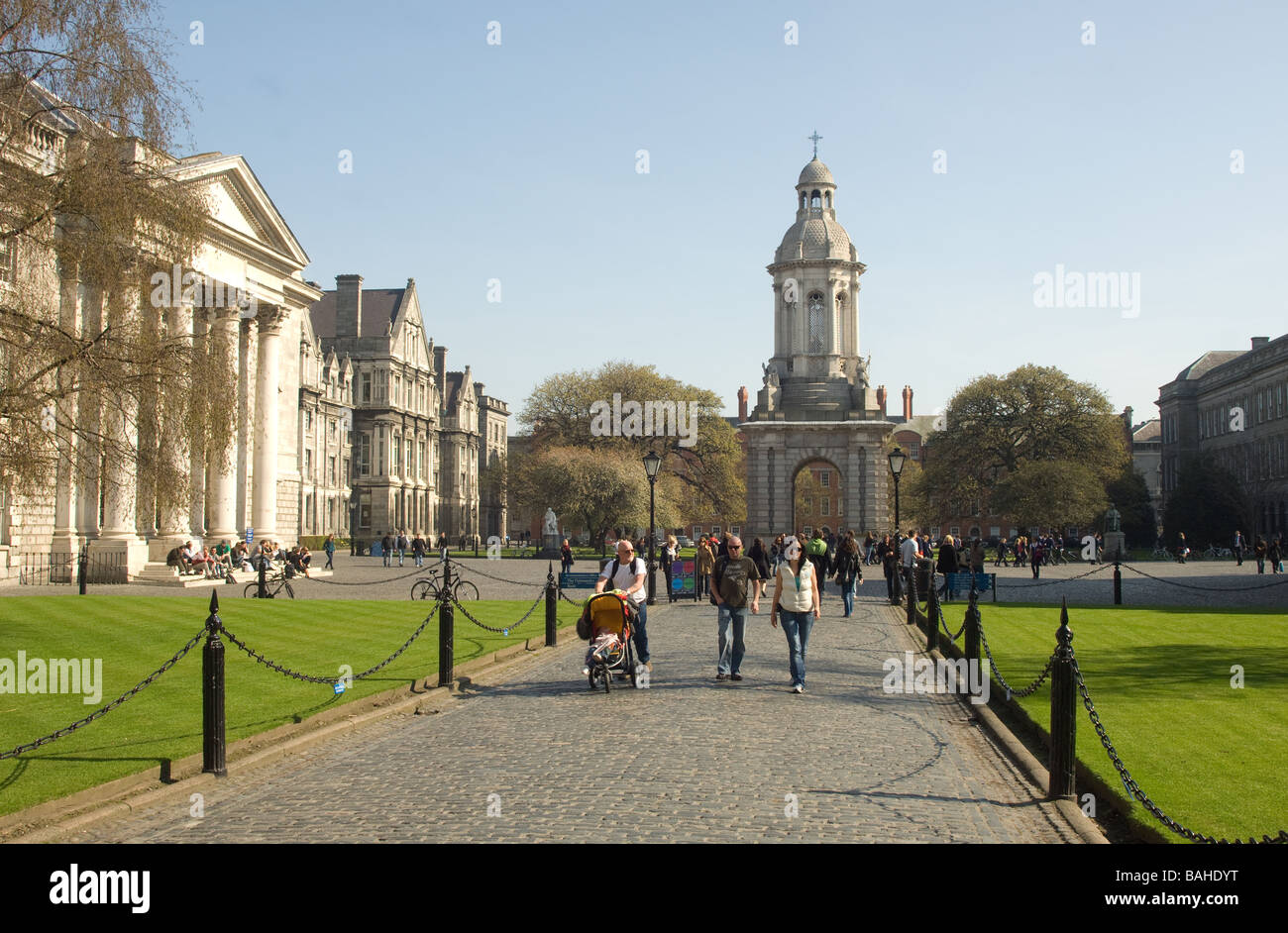 People strolling on cobblestones at Trinity College, Dublin, Ireland Stock Photo