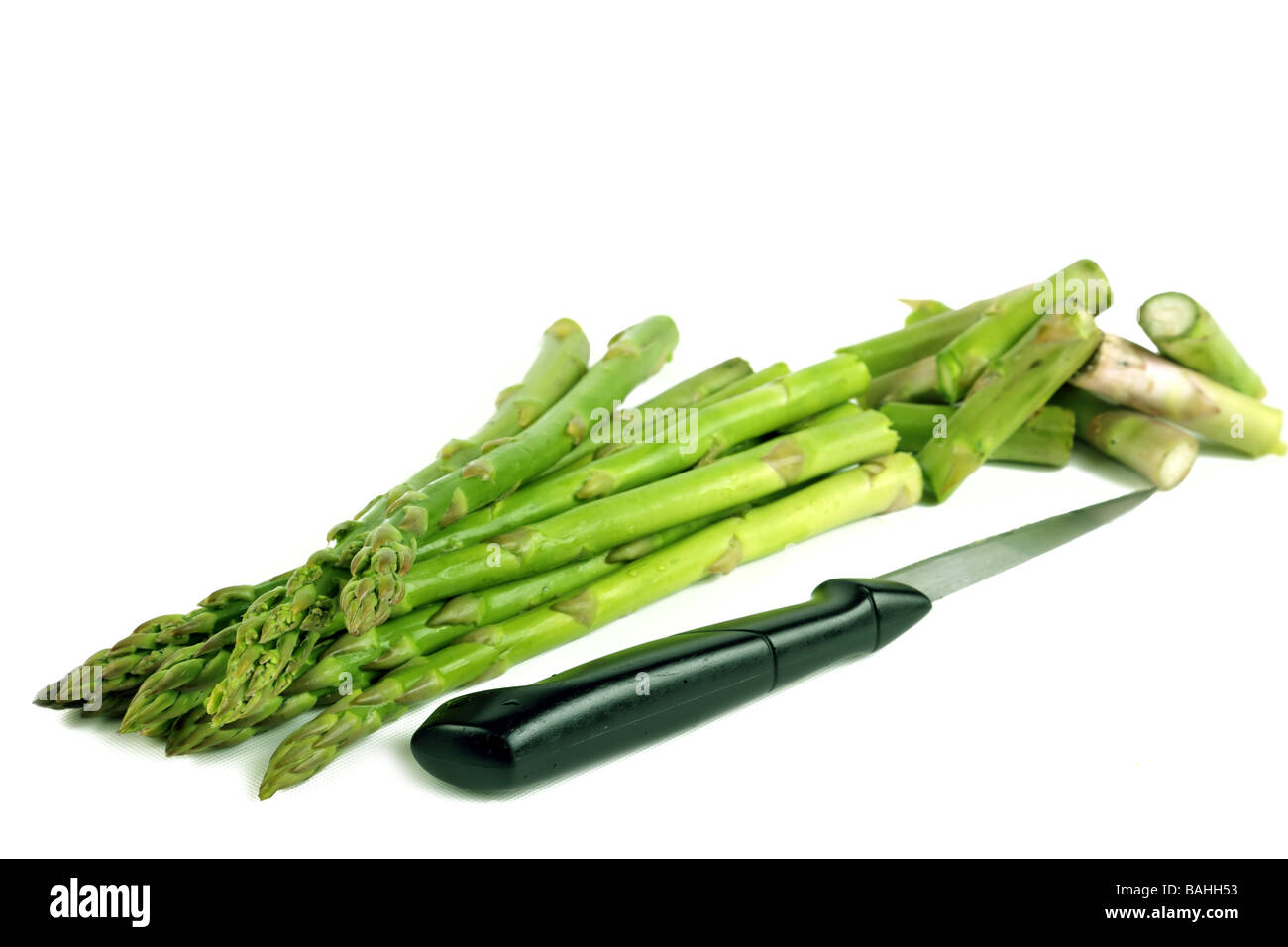 Asparagus being prepared with a knife Stock Photo Alamy