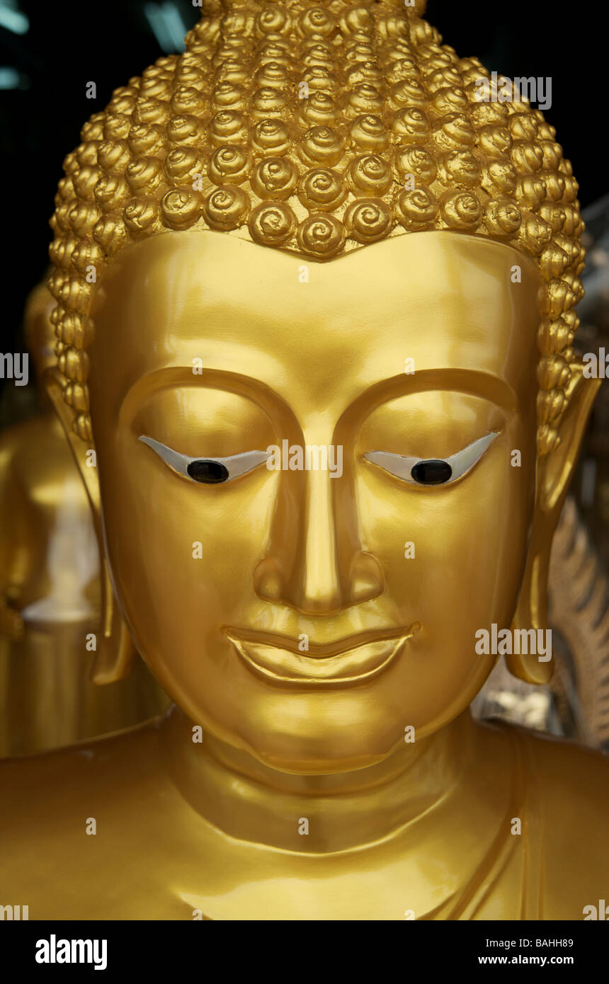 Close up of the face of a buddha statue hires stock photography and