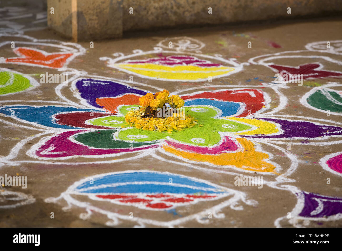 Rangoli festival designs in an Indian street made at the Hindu festival of Sankranthi or Pongal. Stock Photo
