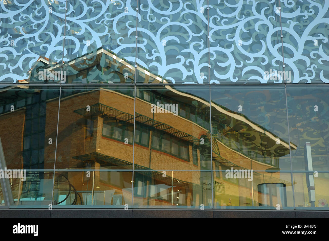 facade of the John Lewis department store reflecting the building