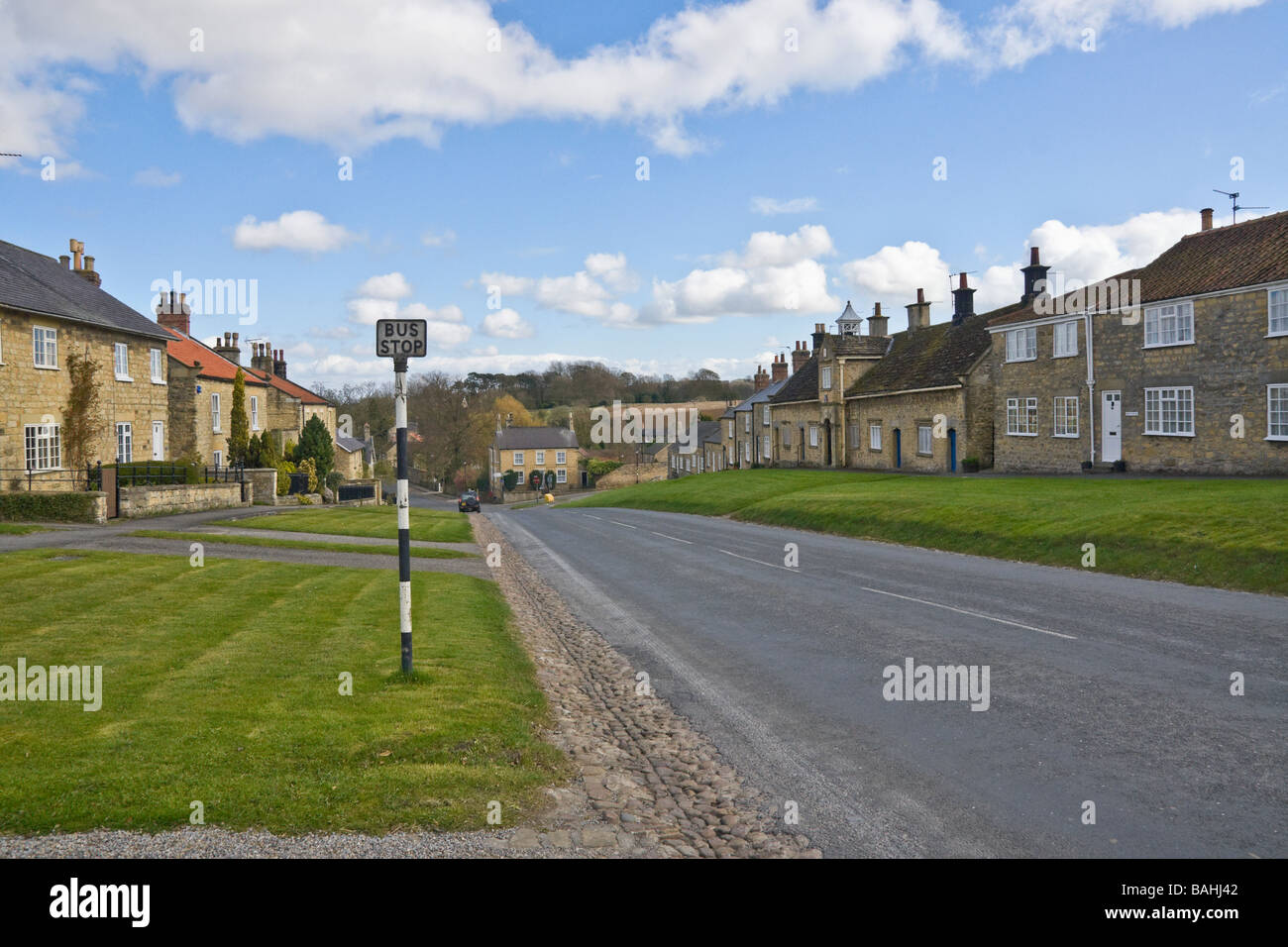 Village green and bus stop at Coxwold, North Yorkshire, UK Stock Photo
