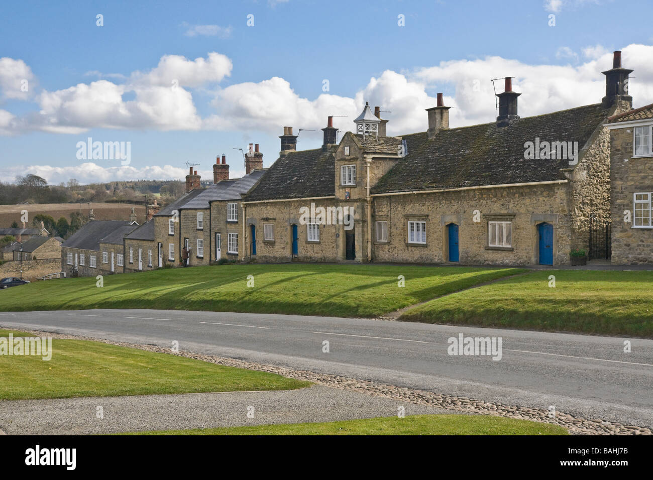 Village  green and almshouses at Coxwold in North Yorkshire Stock Photo