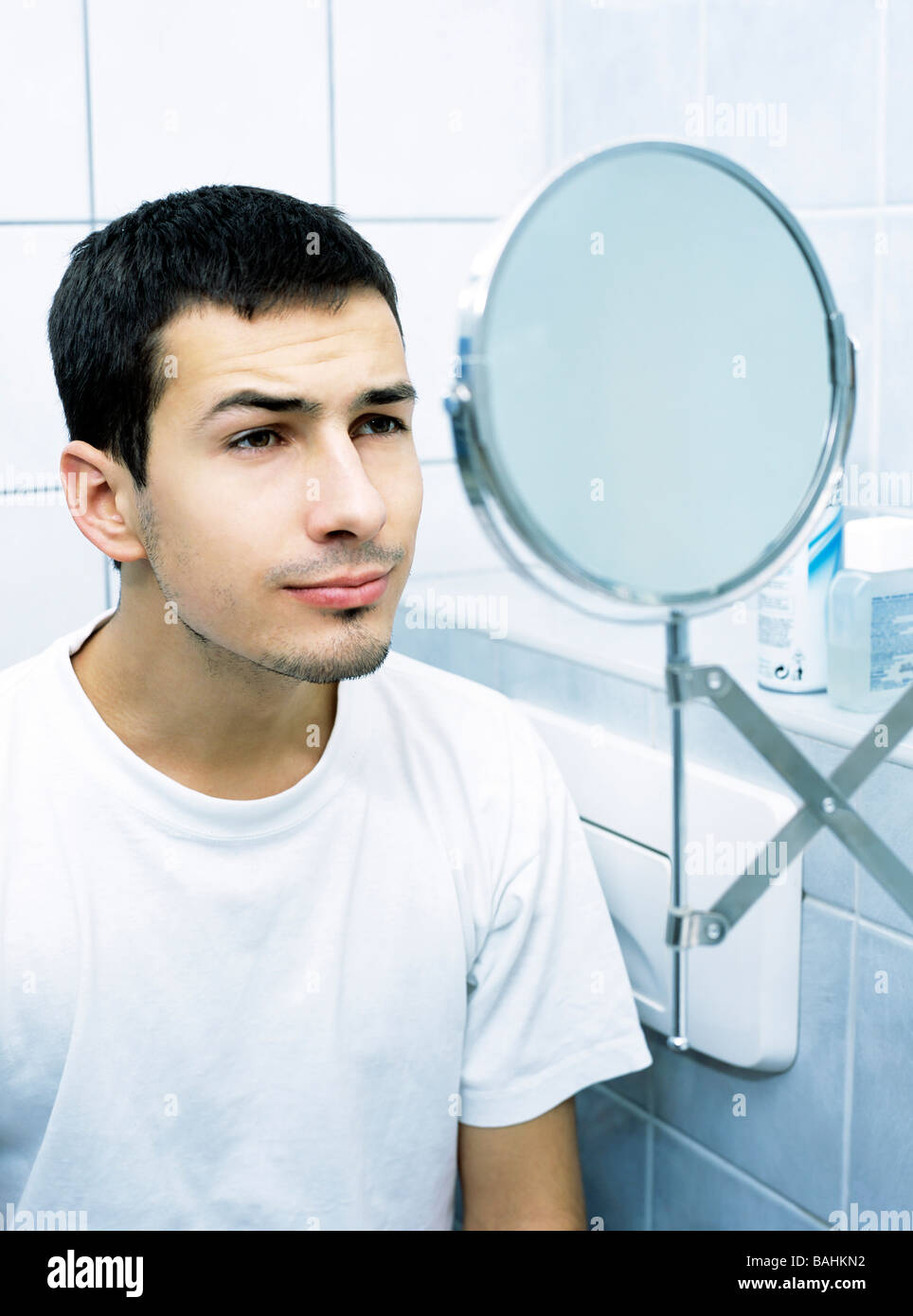 people, man, boy, 20-25, 25-30, dark, haired, beard, mirror, bathroom, indoor, vertical Stock Photo