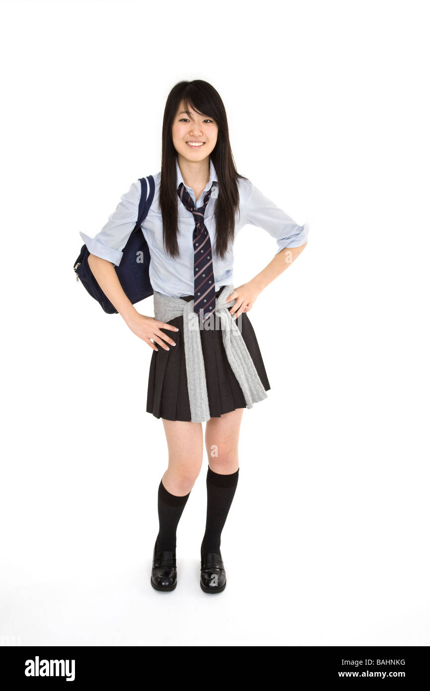 Portrait of a female Asian teenager dressed in the traditional Japanese schoolgirl clothing. Stock Photo