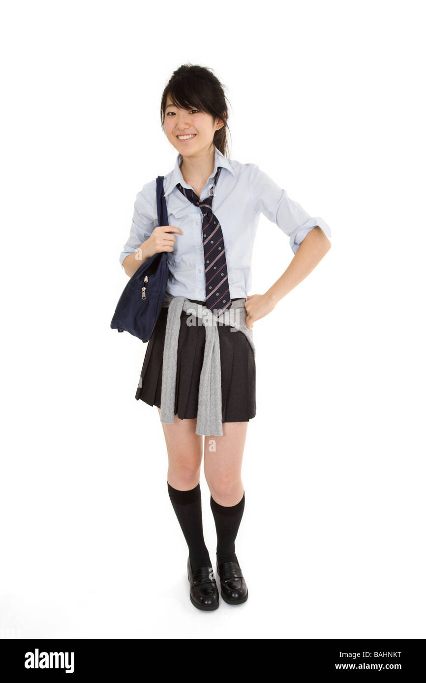 Portrait of a female Asian teenager dressed in the traditional Japanese schoolgirl clothing. Stock Photo
