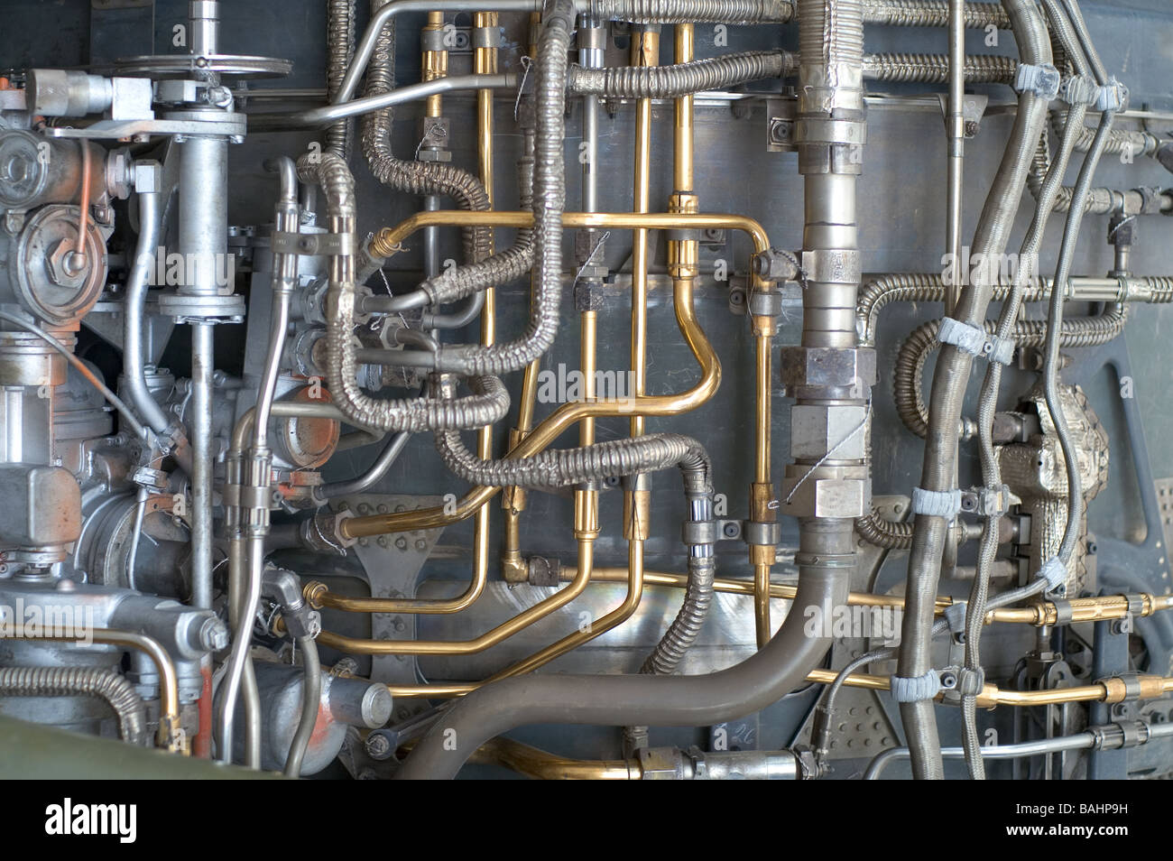 Fuel Lines and Hydraulics on the side of a turbine jet engine Stock Photo
