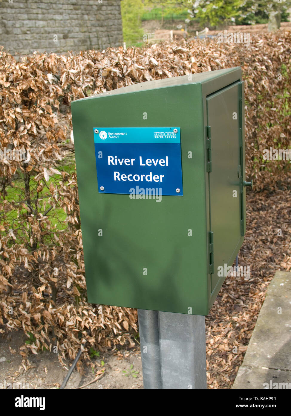 River level recorder mounted on a bridge over a small river Stock Photo