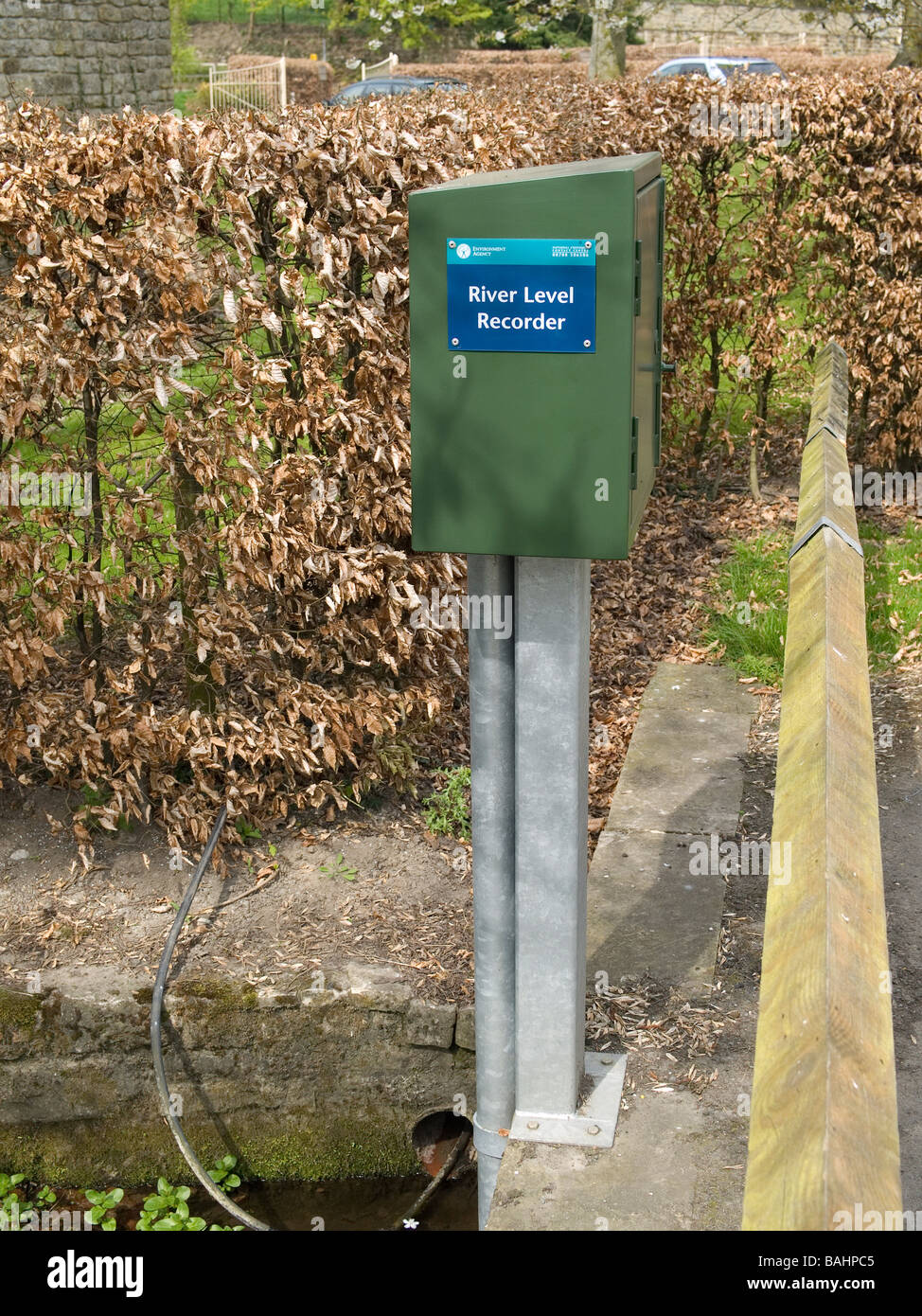 River level recorder mounted on a bridge over a small river Stock Photo