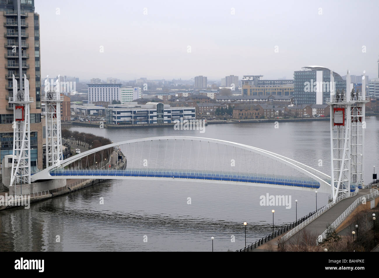 Millennium Lifting Footbridge over the Manchester Ship canal, Salford Quays, Manchester, England, UK Stock Photo