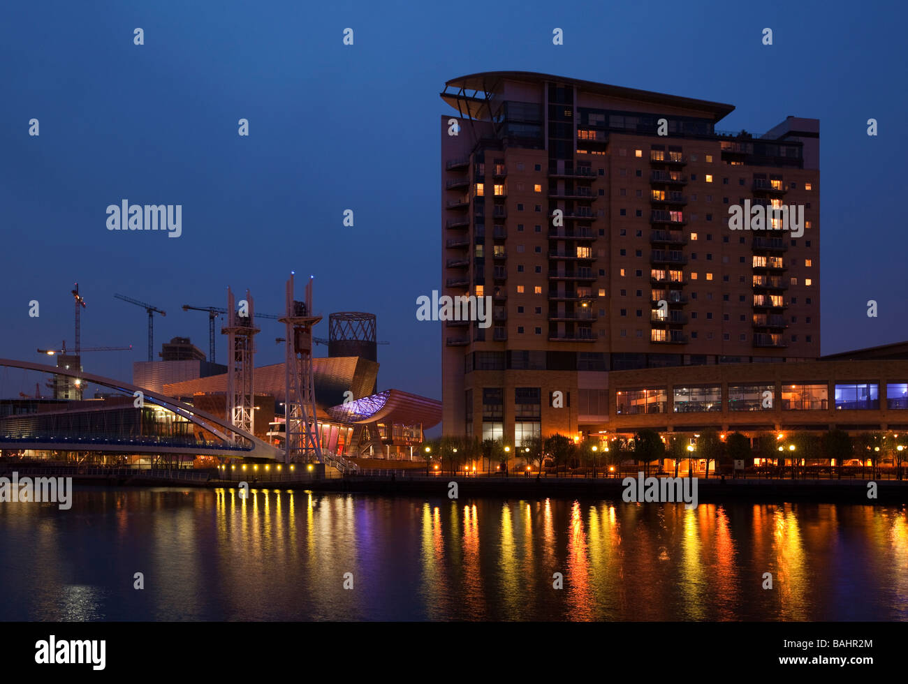 UK England Salford Quays Lowry Centre and Sovereign Point over Manchester Ship Canal at night Stock Photo