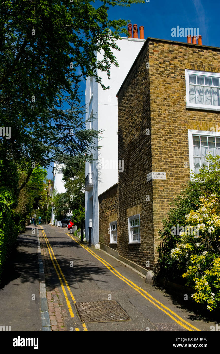 Spring in Hampstead Village , typical street scene of cottage house houses in Benham's Place on Holly Hill , dated 1813 Stock Photo