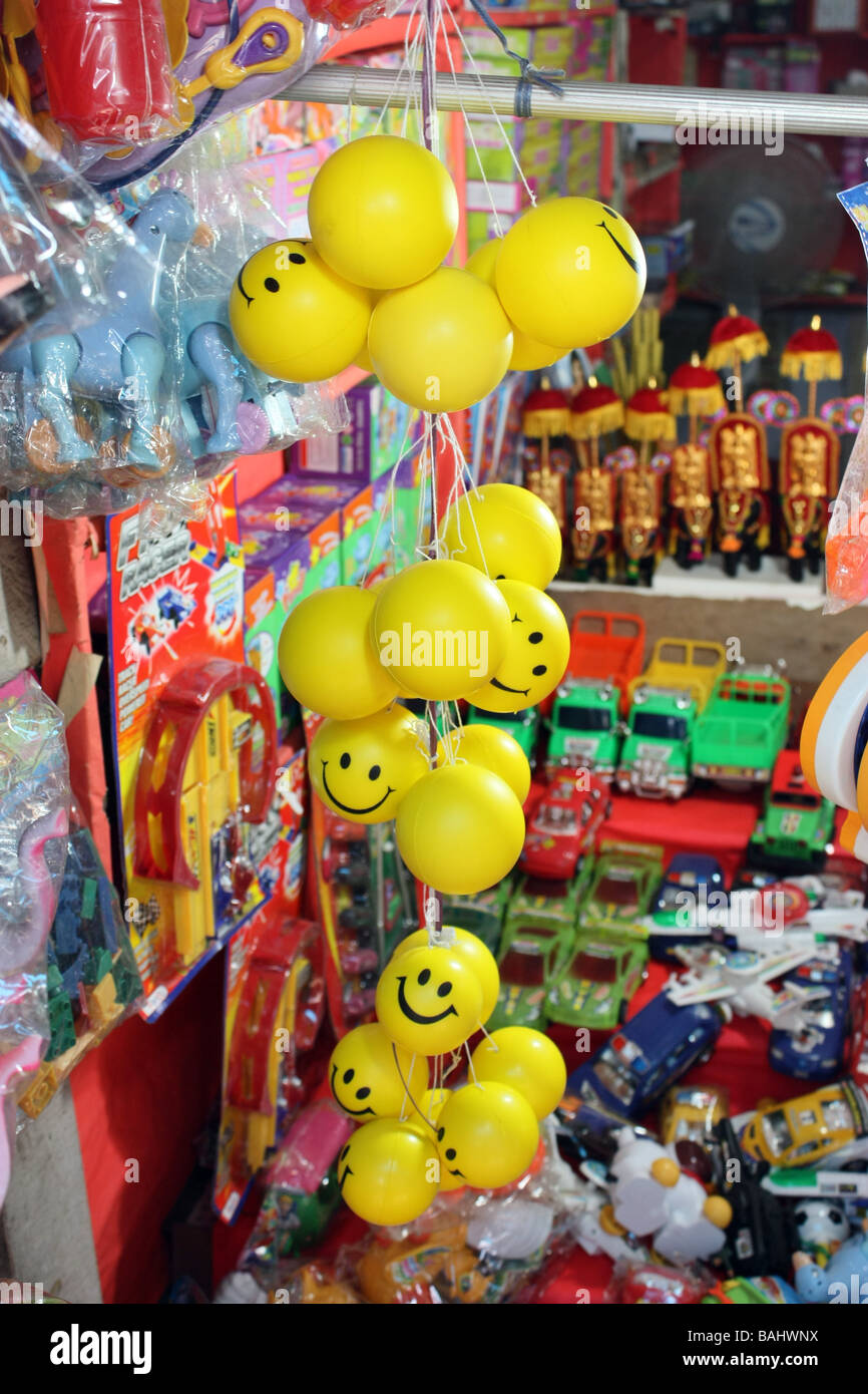 Bunch of Smiley Balls hanging in shop for sale Stock Photo