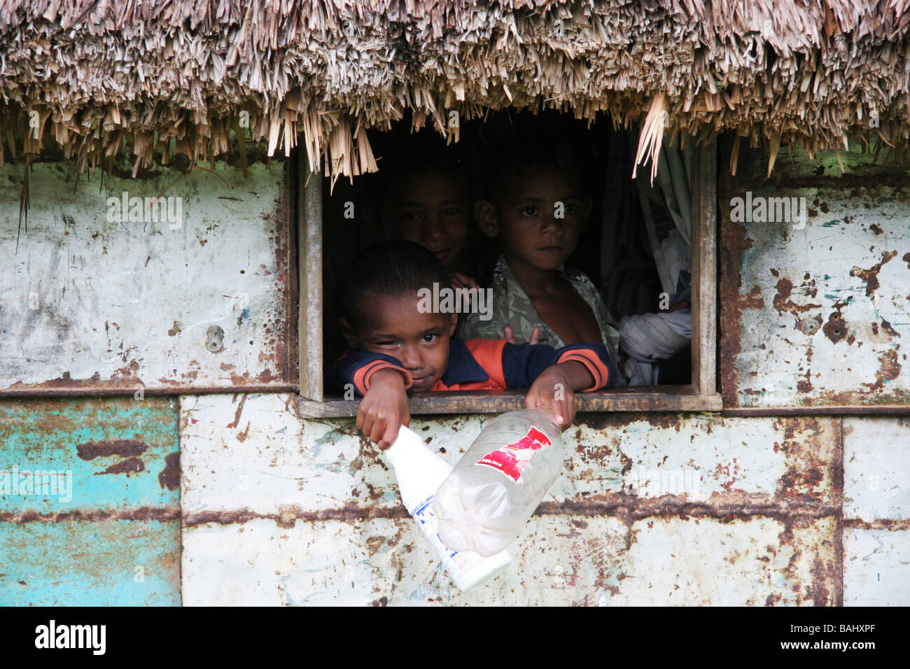 Children in hut - Fijian village Stock Photo