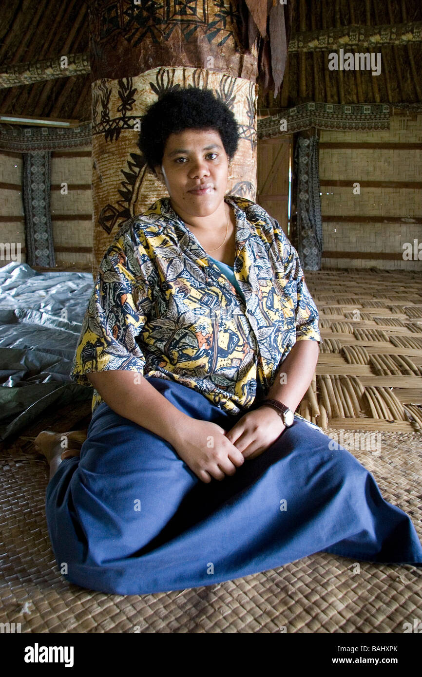 Fijian lady sitting in bure / hut Stock Photo