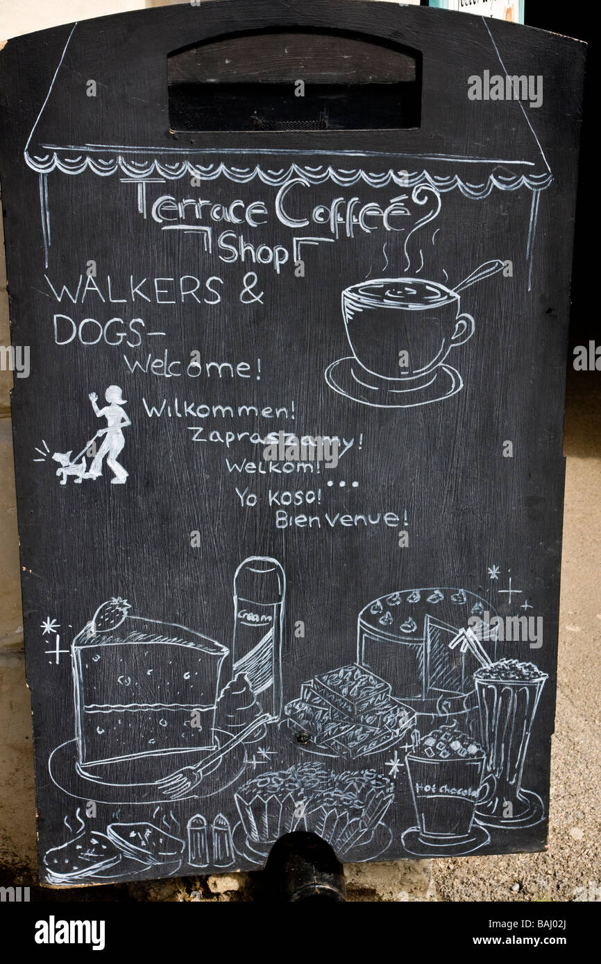 'welcome board' in six languages outside a coffee shop in Helmsley, North Yorkshire. Stock Photo