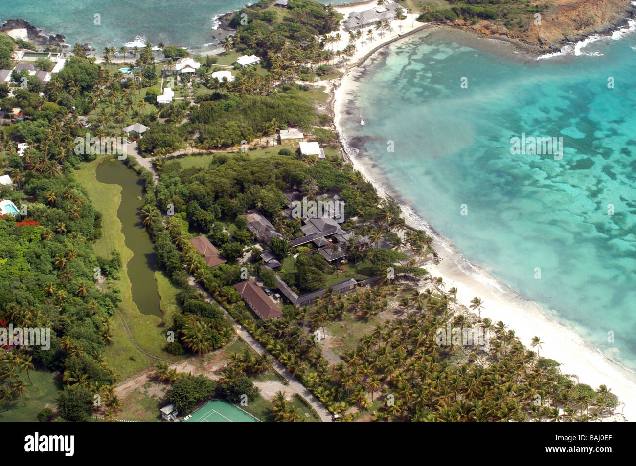 Mustique is a small private island in the West Indies on the edge of the  Caribbean Sea. Pictured is Mick Jaggers home Ariel Stock Photo - Alamy