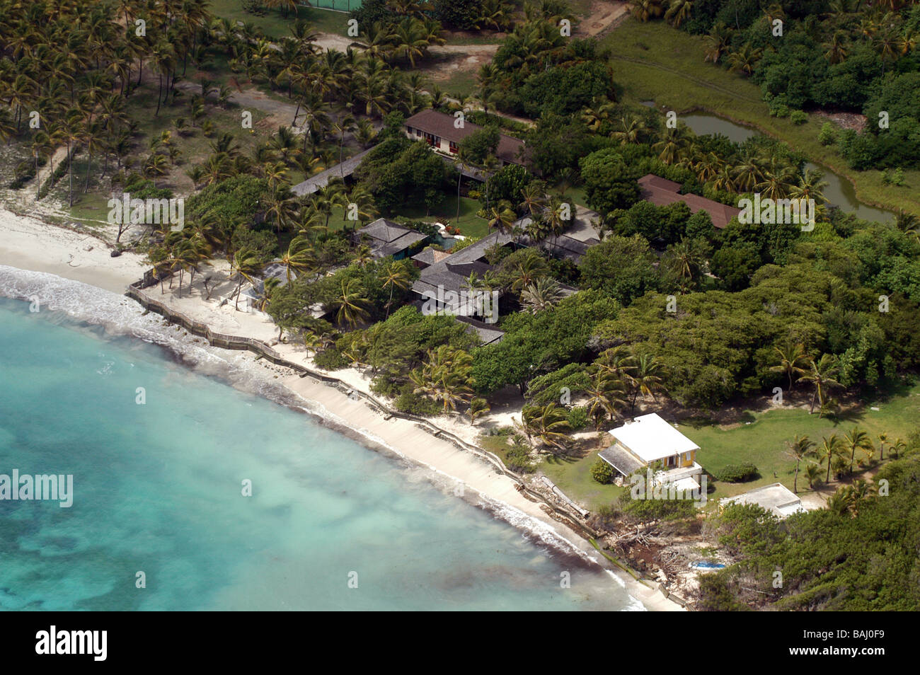 Mustique is a small private island in the West Indies on the edge of the Caribbean Sea. Pictured is Mick Jaggers home Ariel Stock Photo